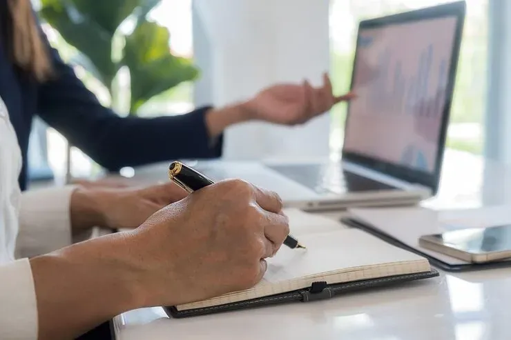 midsection-man-using-laptop-table